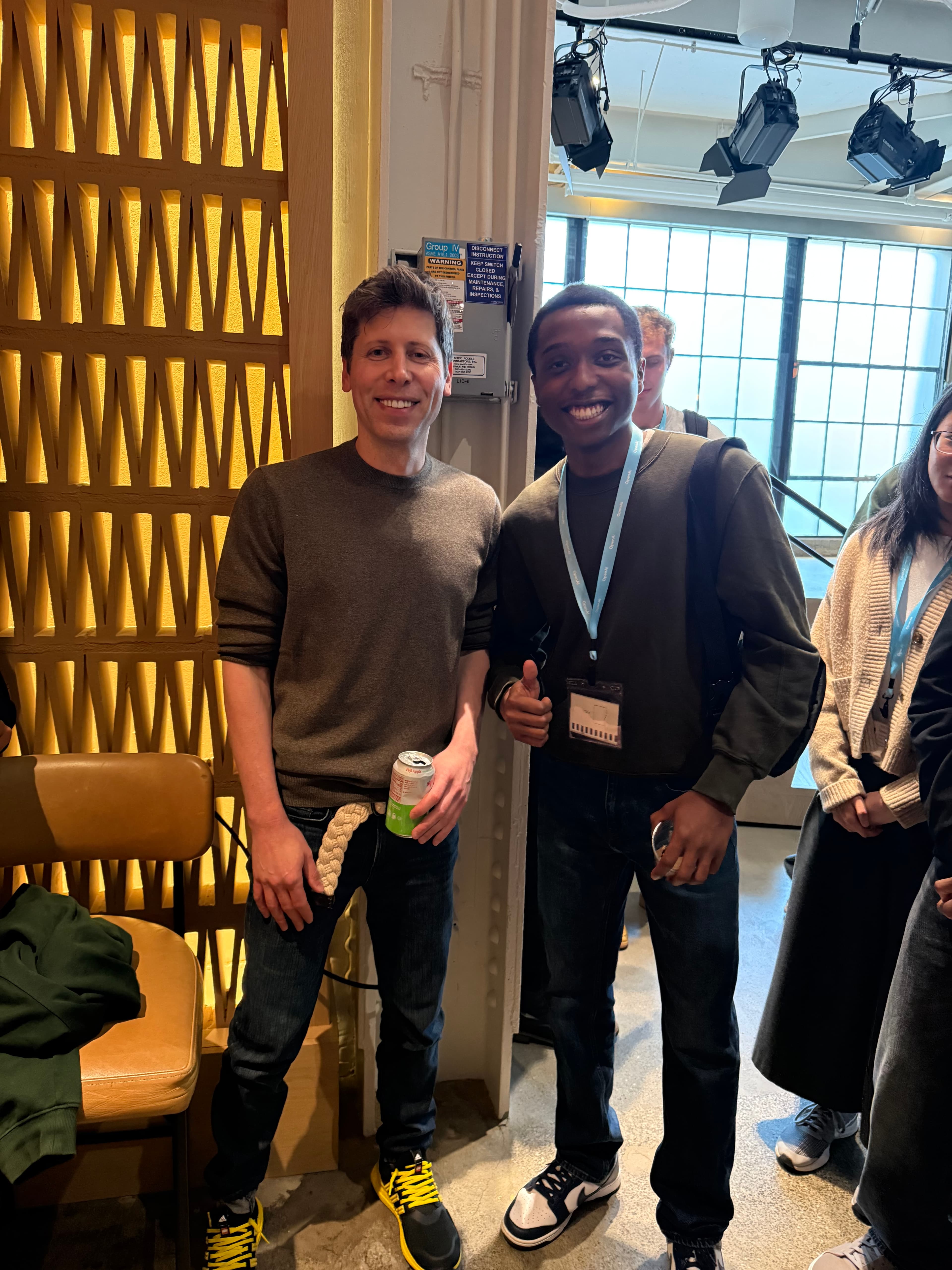 Ifeoluwa with Sam Altman at the OpenAI Student Collective Builder Party